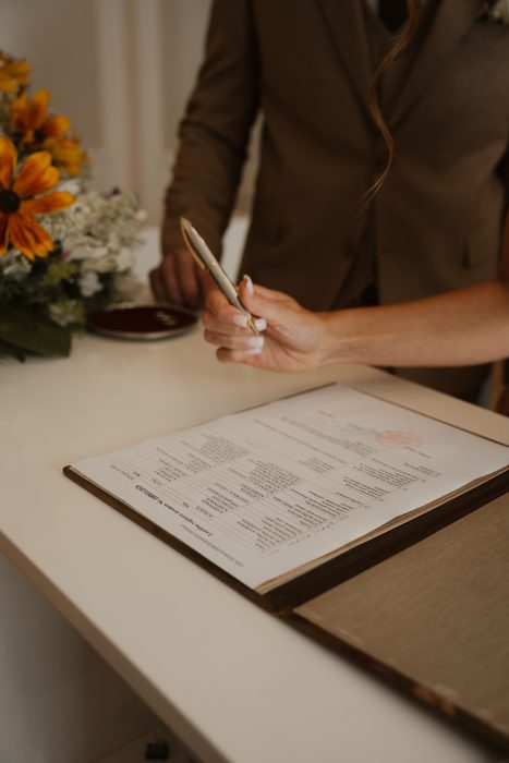 Signing wedding documents during the ceremony