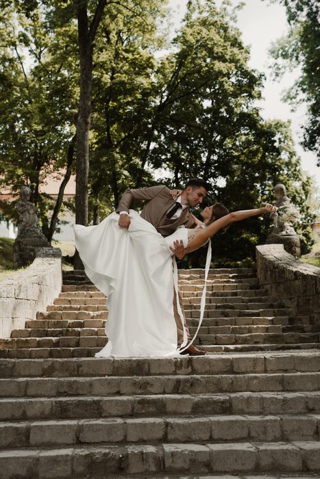Bride and groom on stone steps