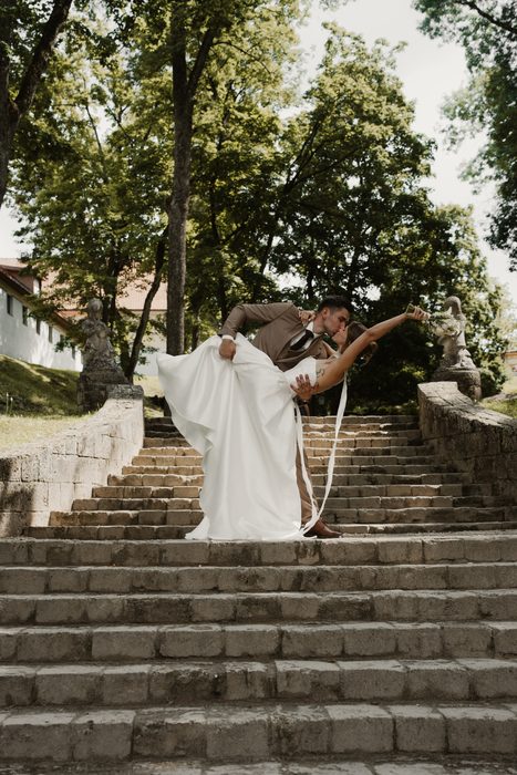 Bride and groom on stone steps
