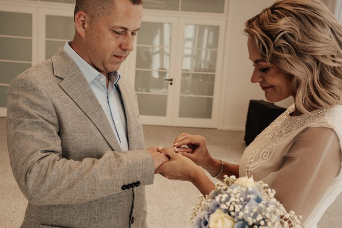 Newlyweds exchanging rings